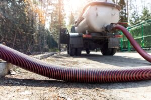 What are the signs that a septic tank needs to be pumped